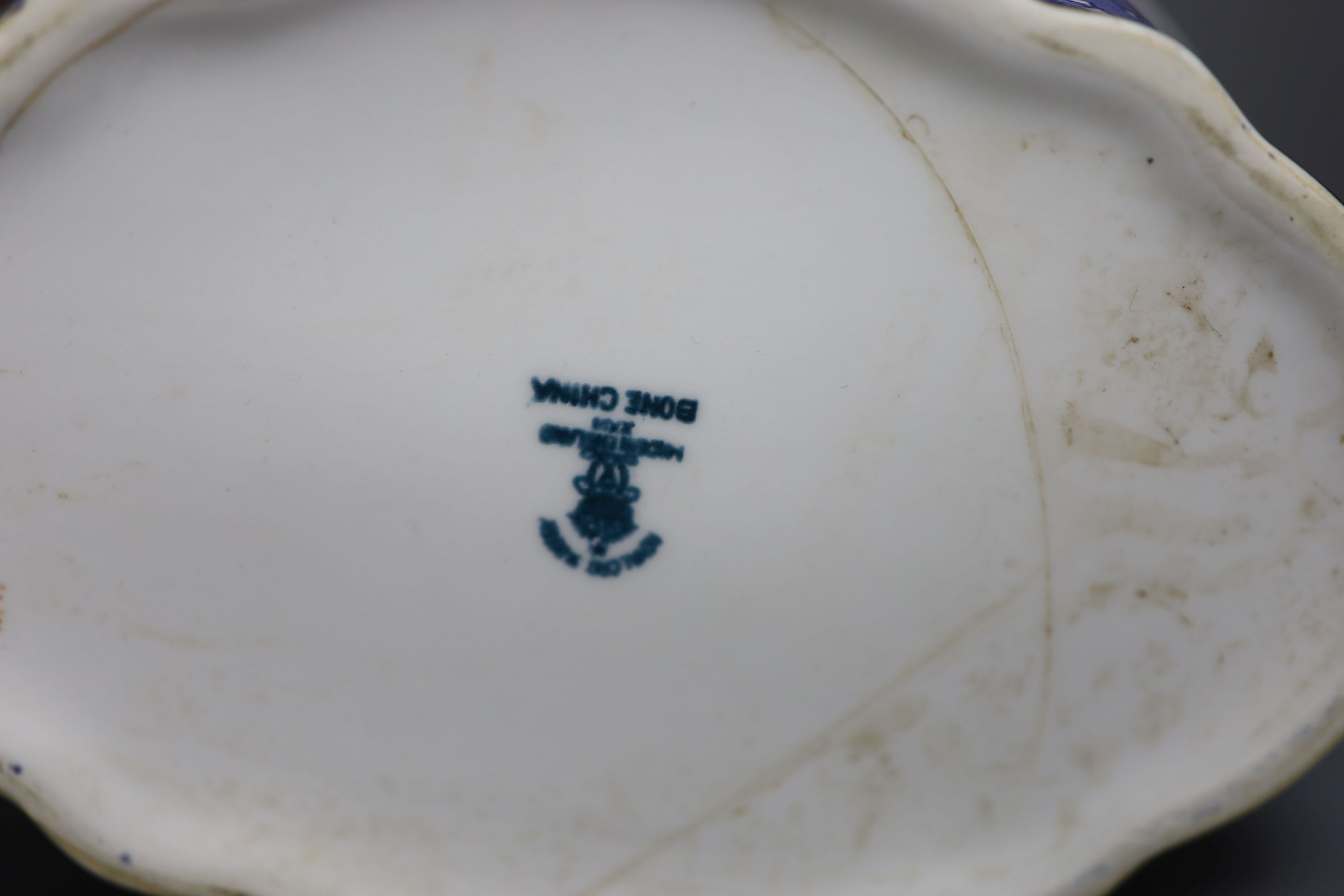 Three various porcelain teapots, a cream jug and a sucrier